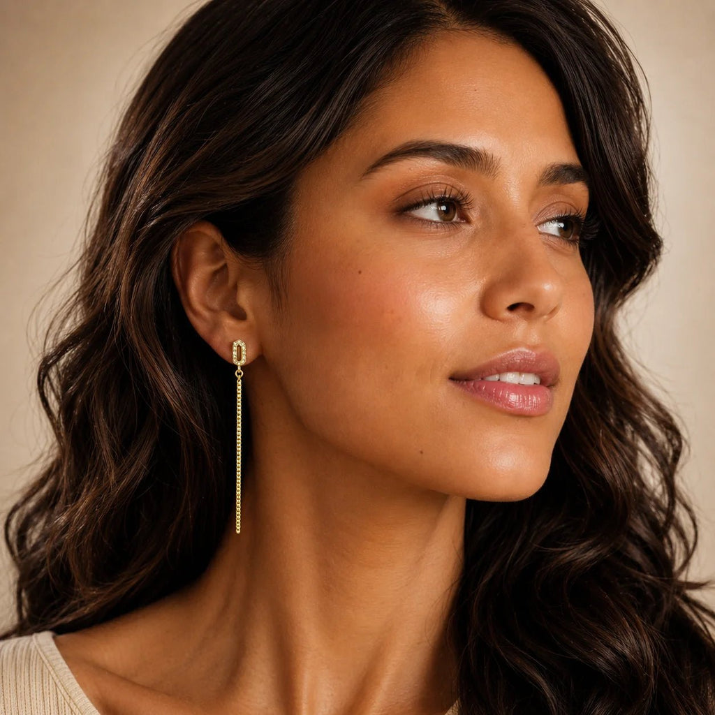 Model wearing lightweight gold-filled CZ chain drop earrings