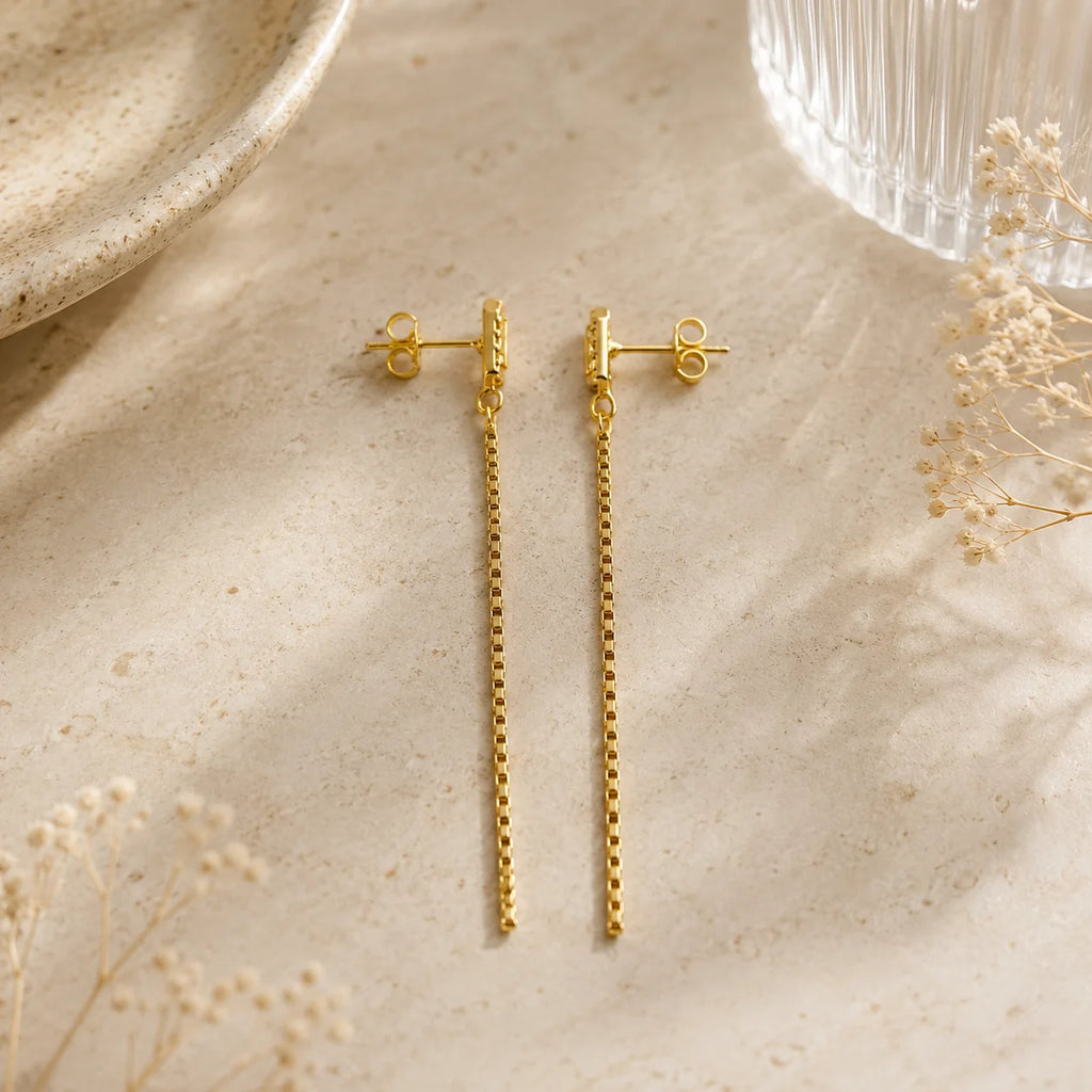 Close up of pavé CZ rectangular stud on Ma Vie cascade drop earrings, 18k gold filled