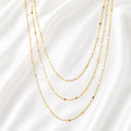 Ma Vie dainty curb chain necklace layered with other gold chains, 18k gold filled stacking