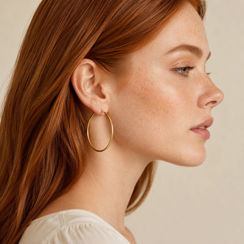 Model wearing lightweight gold-filled endless hoop earrings in profile