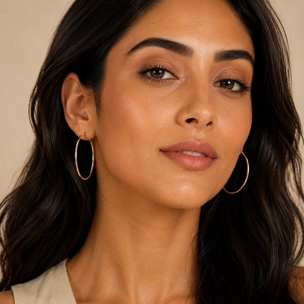 Model wearing everyday 18K gold-filled hoop earrings