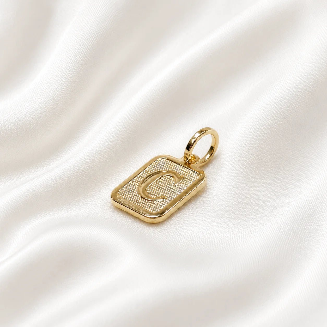 Letter C textured 18K gold-filled initial pendant on ivory silk