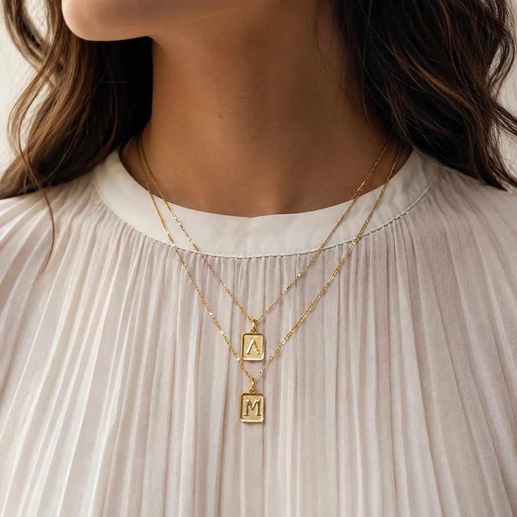 Initial pendant necklace on model neckline, 18k gold filled personalized charm daily wear