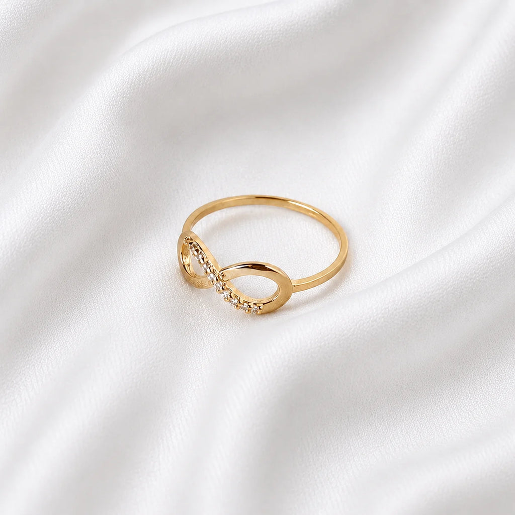 Ma Vie eternity band ring flat lay on white silk, 18k gold filled with CZ stones around band