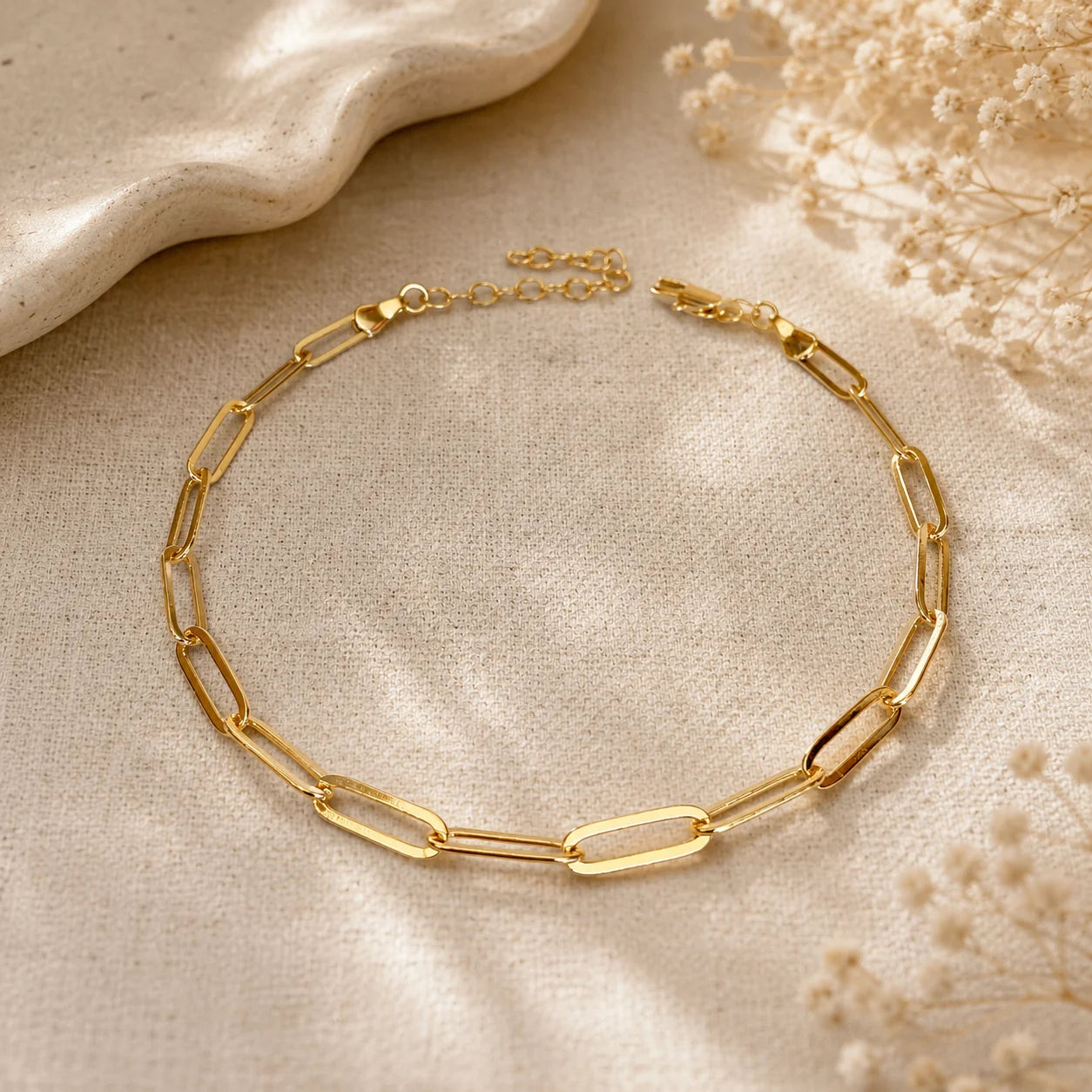 Close up of Ma Vie paperclip chain anklet, 18k gold filled elongated rectangular links