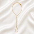 Close up of Ma Vie pearl hand chain bracelet, 18k gold filled with imitation baroque pearl charm