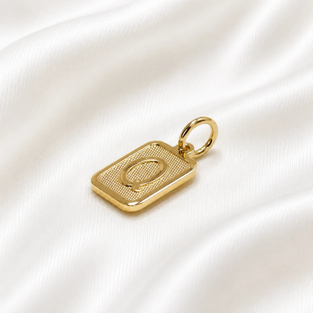 Personalized letter necklace in 18k gold filled, square charm on silk backdrop