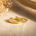 Two 18k gold filled wave stacking rings on silk, polished and open top design